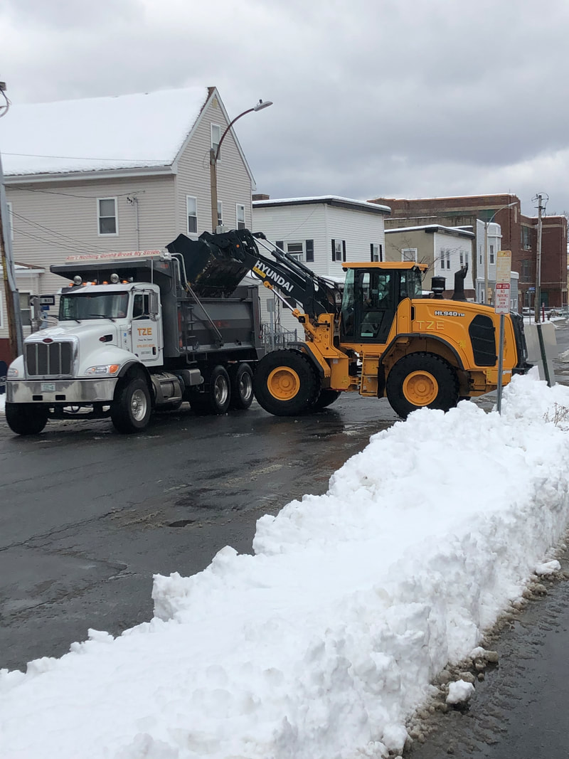 Tim Zanelli Excavating crew performing water and sewer utility work in the field