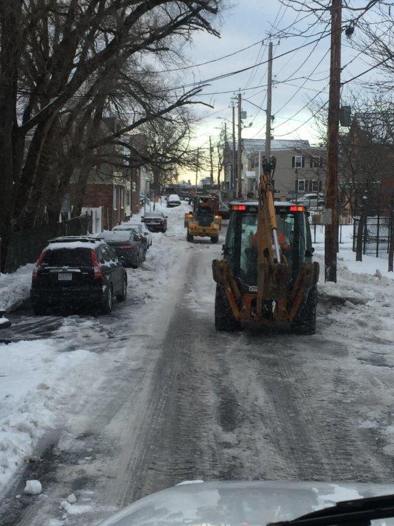 Utility crew installing new infrastructure in an open trench